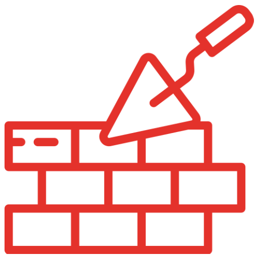 Multiple wooden house frames under construction on a residential building site.